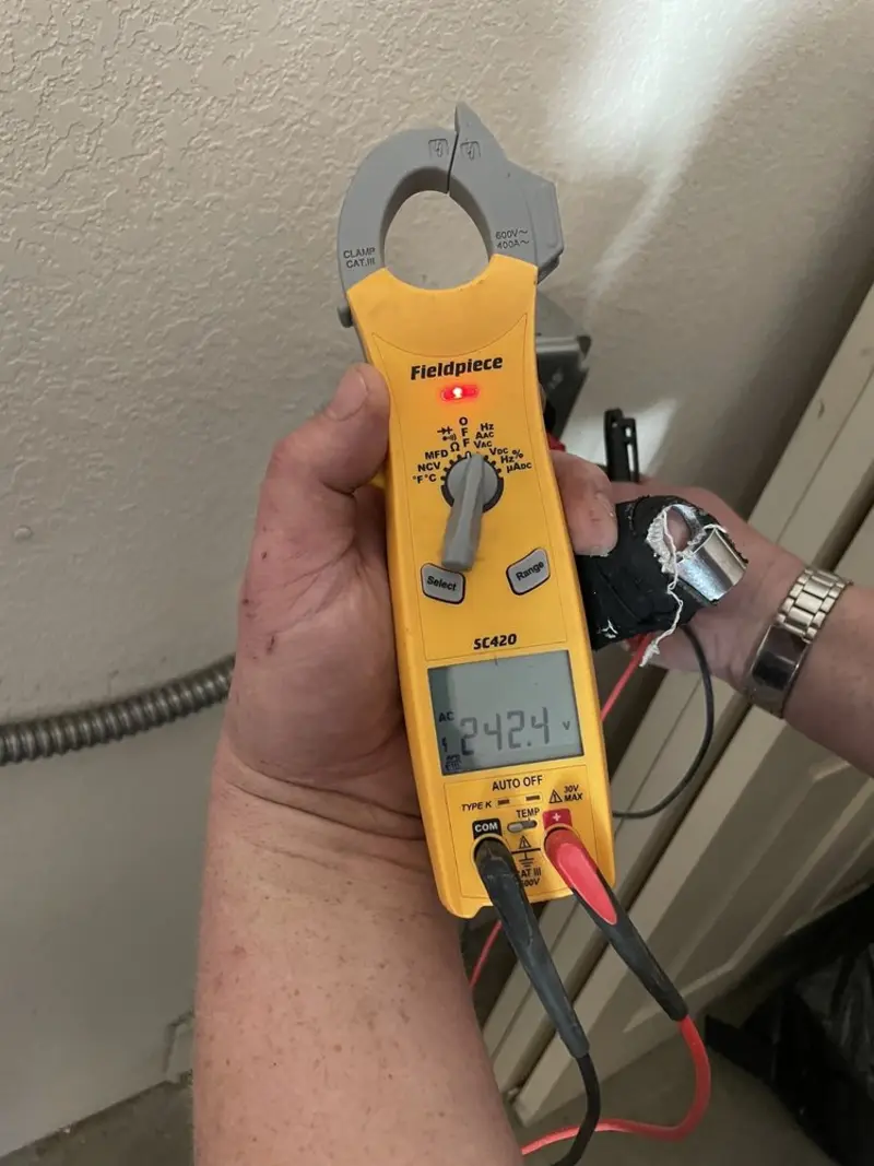 Voltage testing with clamp meter during Recessed Lighting Installation in Constantia